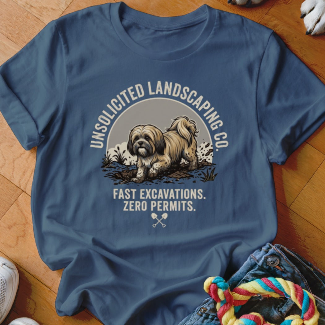 Blue t-shirt with a dog digging dirt and text "Unsolicited Landscaping Co."
