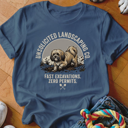 Blue t-shirt with a dog digging dirt and text "Unsolicited Landscaping Co."