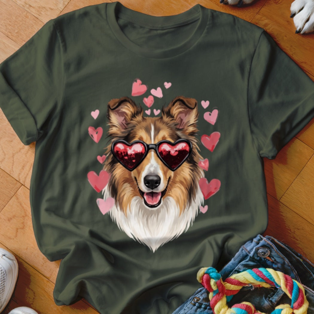 Dark green t-shirt featuring an illustration of a Sheltie dog wearing heart-shaped sunglasses surrounded by pink hearts.