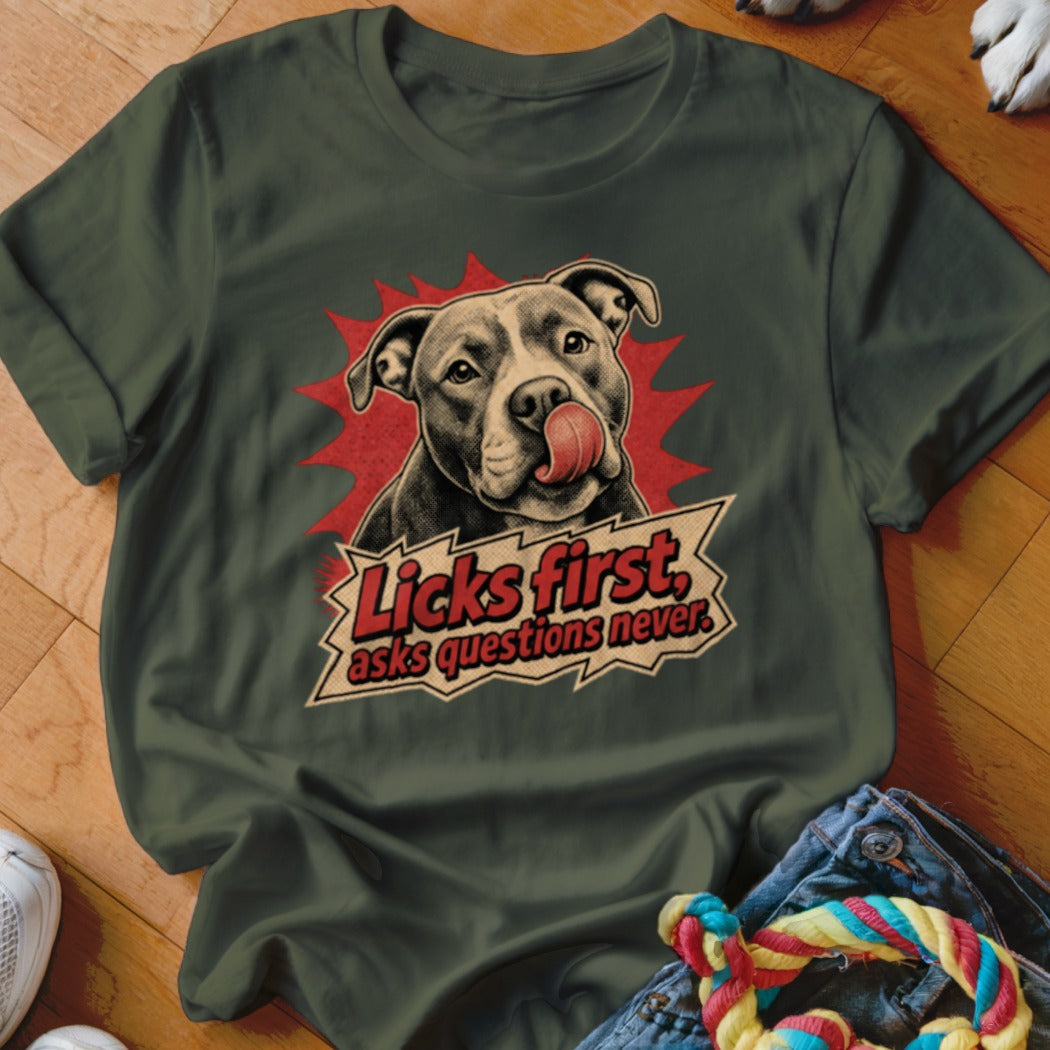Green t-shirt with Pitbull licking its nose, text "Licks first, asks questions never."