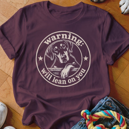T-shirt with white circular graphic of dog and text "warning: will lean on you".