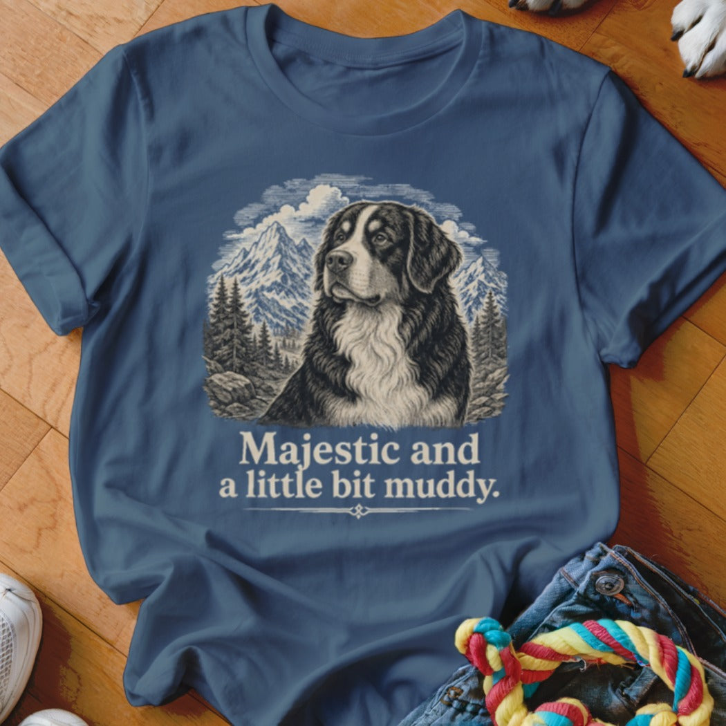 Bernese Mountain Dog in mountains graphic on blue t-shirt with text "Majestic and a little bit muddy."