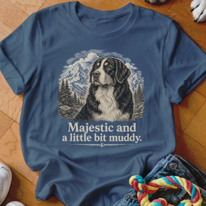 Bernese Mountain Dog in mountains graphic on blue t-shirt with text "Majestic and a little bit muddy."