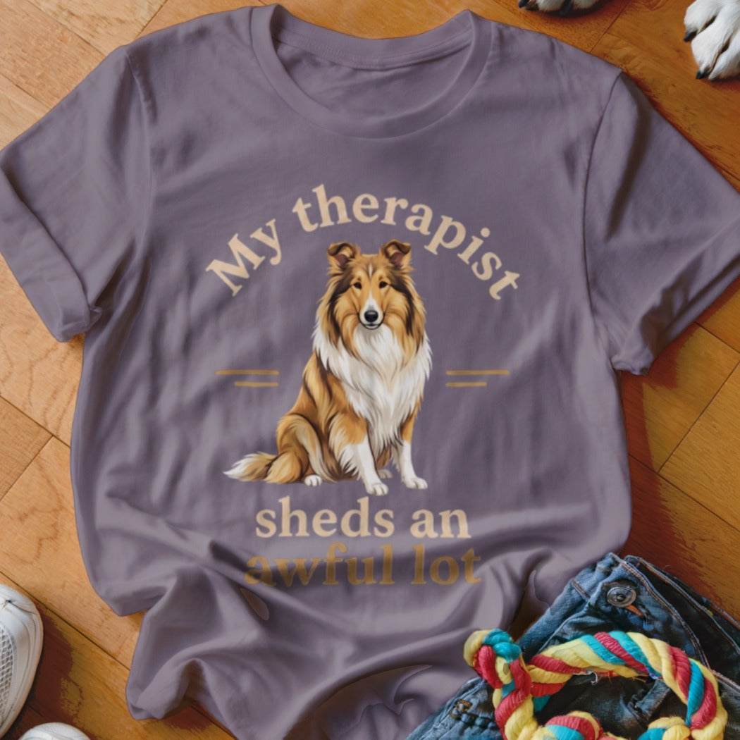 Purple t-shirt with a Collie dog graphic and text "My therapist sheds an awful lot."