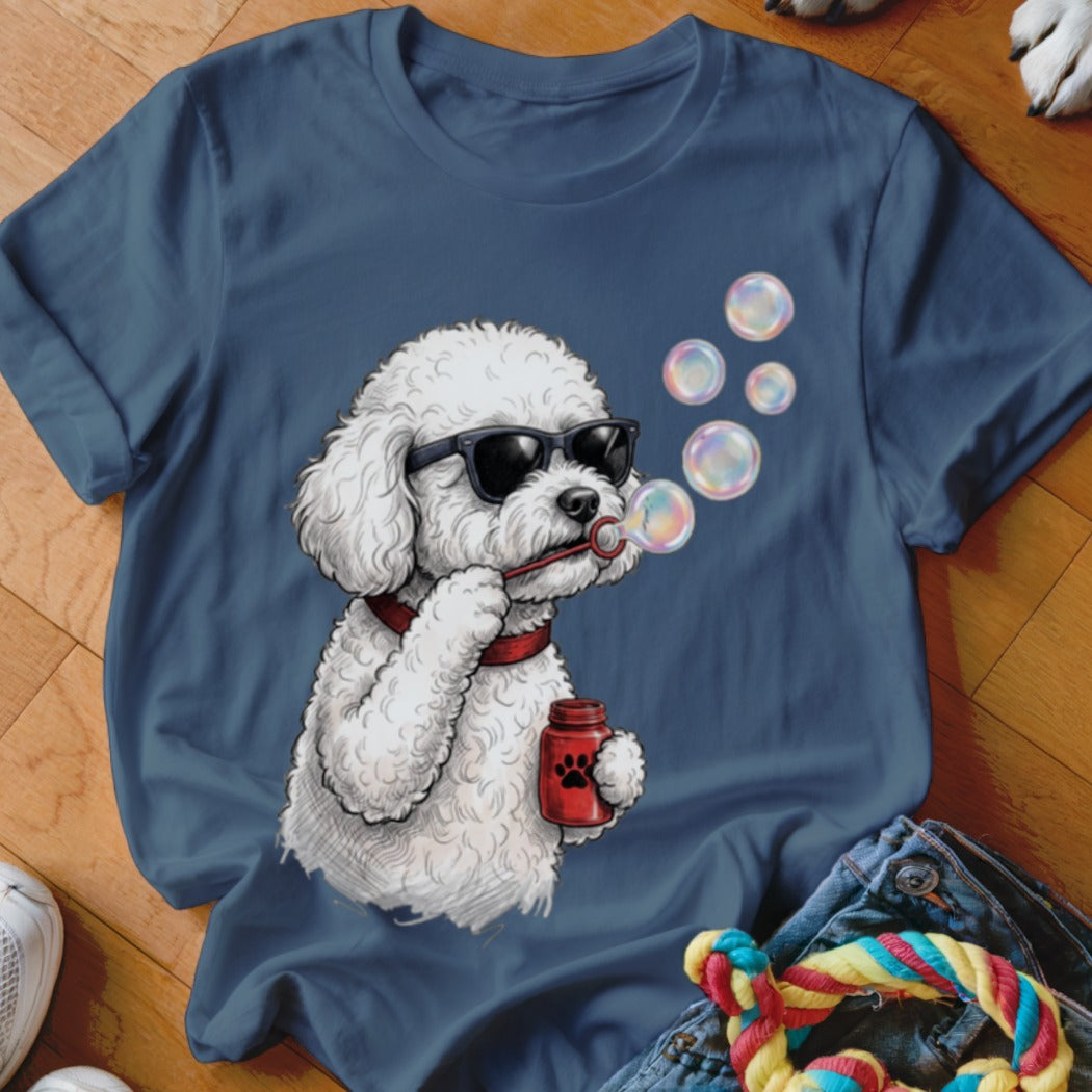Navy blue t-shirt featuring a graphic of a white poodle wearing sunglasses and blowing bubbles.
