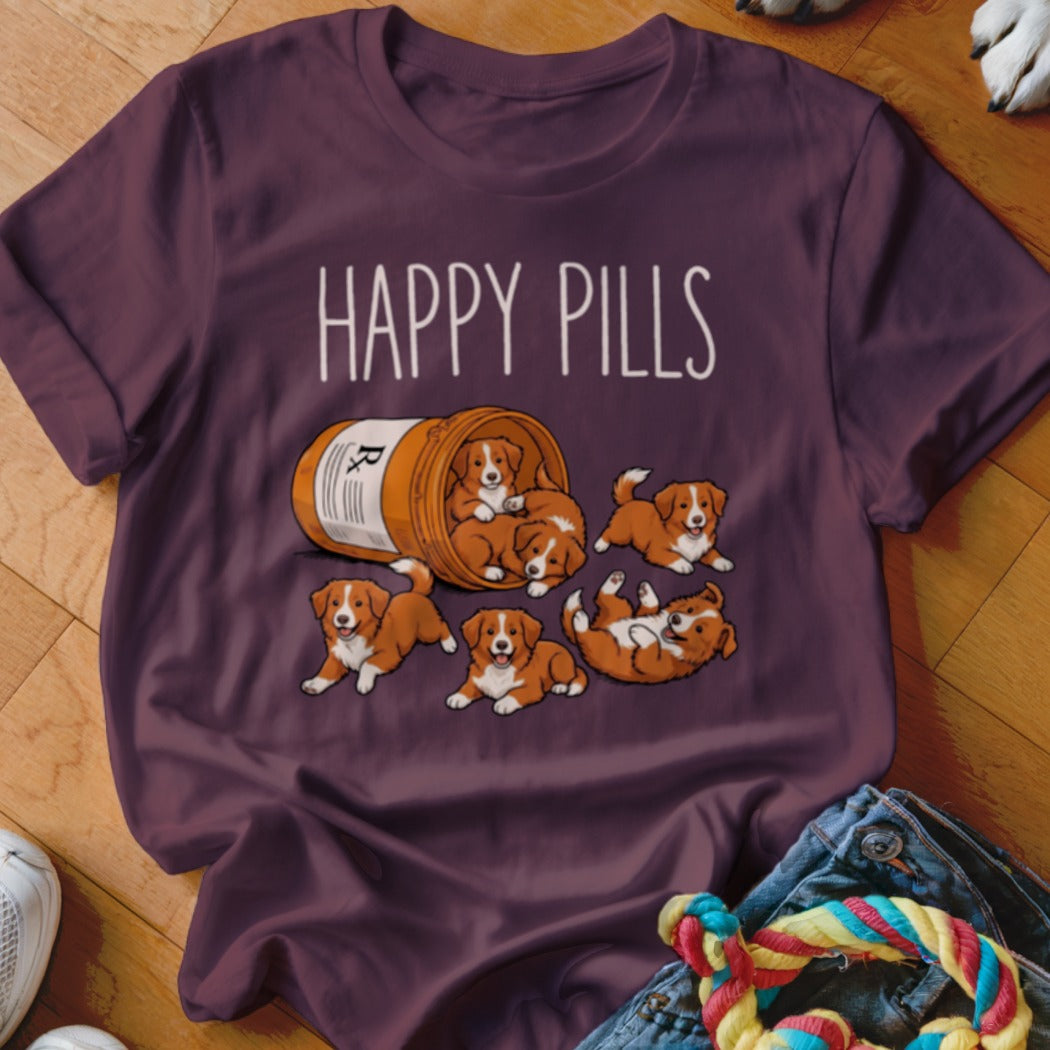 T-shirt with cartoon puppies spilling from a pill bottle, text reads "Happy Pills".
