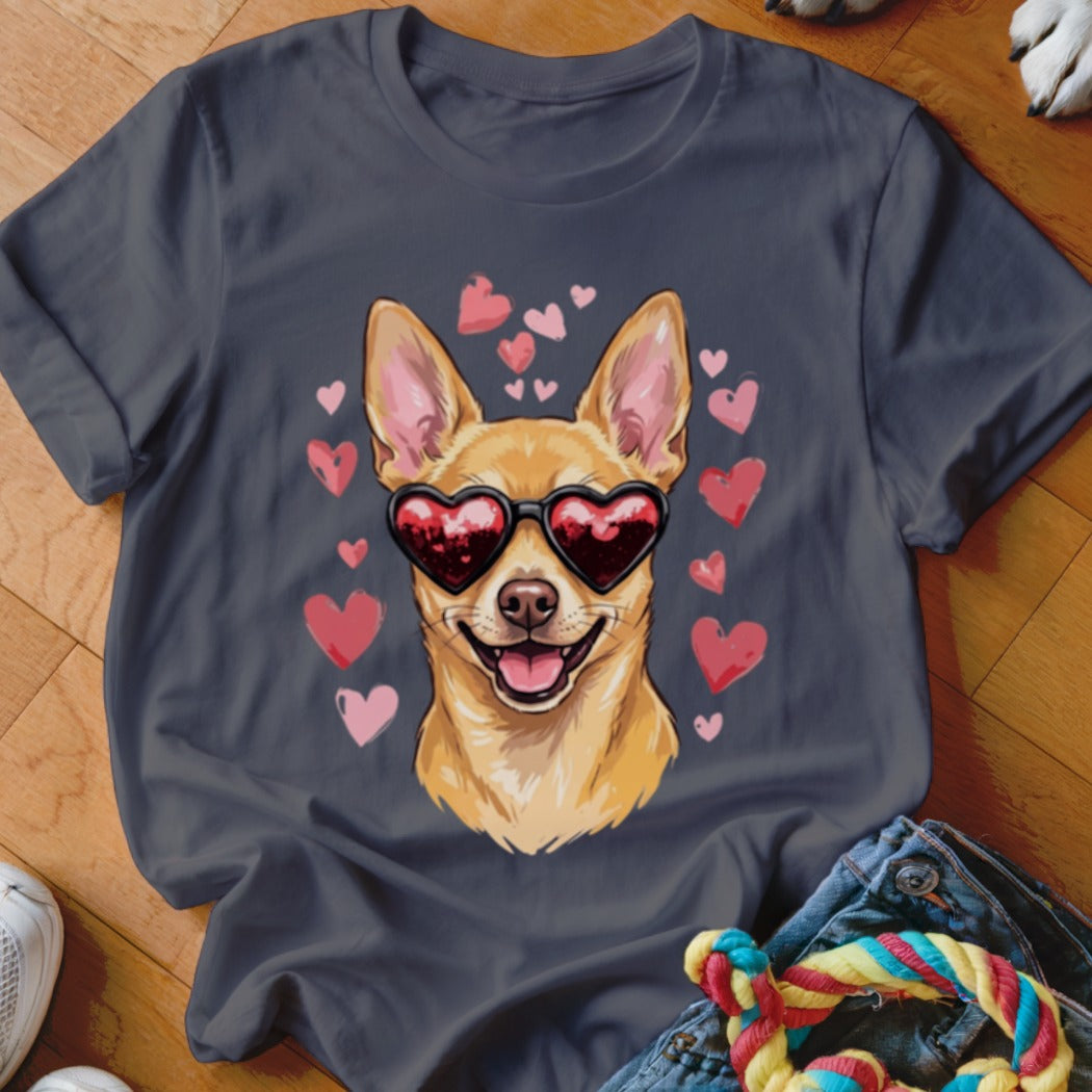Dark grey t-shirt featuring a graphic of a smiling Chihuahua wearing heart-shaped sunglasses surrounded by floating pink hearts.