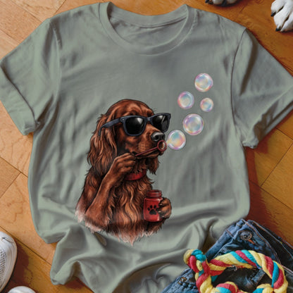Sage green crewneck t-shirt featuring a graphic of an Irish Setter wearing sunglasses and blowing soap bubbles.