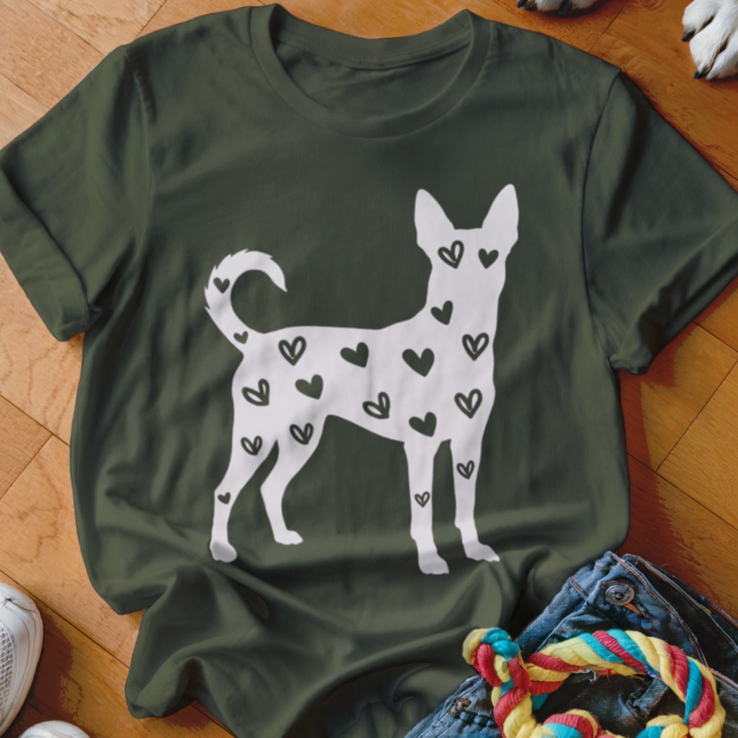 Green t-shirt with white dog silhouette filled with black hearts.