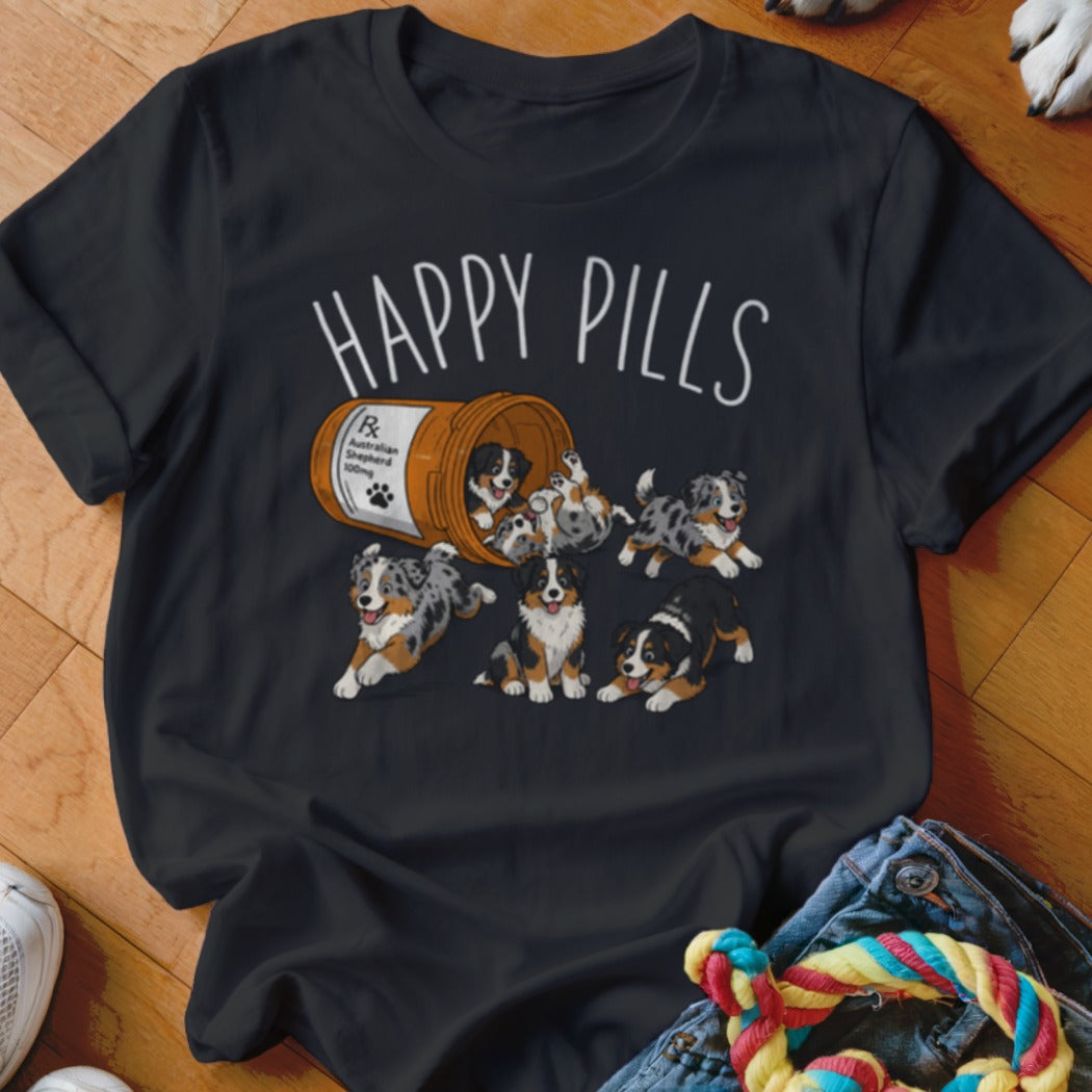 T-shirt with "Happy Pills" text and illustration of Australian Shepherd puppies spilling from a bottle.