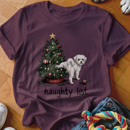 White dog lifting leg by Christmas tree with "naughty list" text.