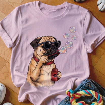 Light pink t-shirt featuring an illustration of a pug wearing sunglasses and blowing soap bubbles.