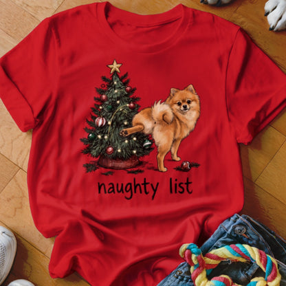 Red t-shirt with a Pomeranian dog next to a Christmas tree, reading "naughty list".