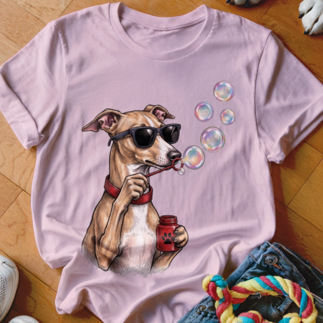 Light pink crewneck t-shirt featuring a graphic of a dog in sunglasses blowing soap bubbles.