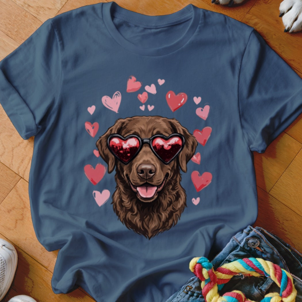 Dark blue t-shirt featuring a graphic of a brown dog wearing heart-shaped sunglasses surrounded by pink hearts.