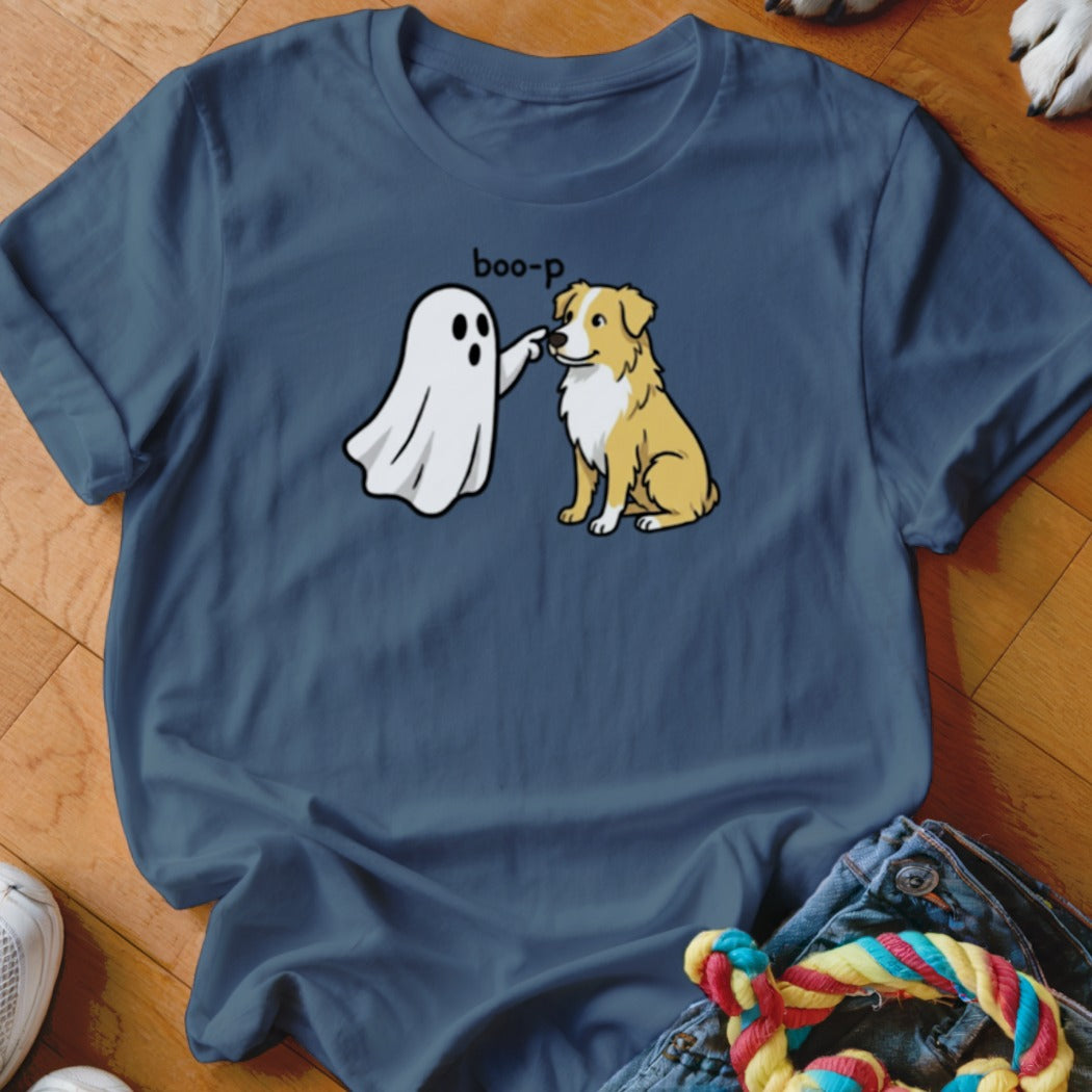 Cartoon ghost "boop"ing a sitting dog on a navy t-shirt.