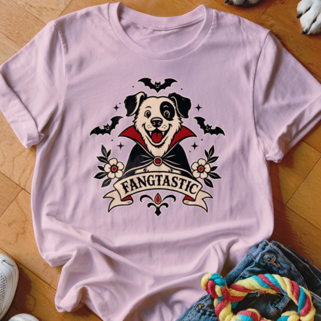 Pink t-shirt with a dog dressed as a vampire and the text "FANGTASTIC".