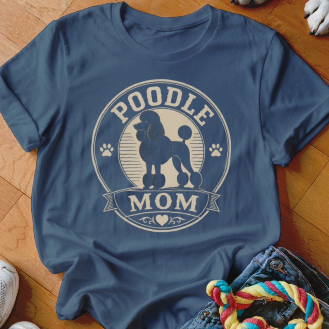 Poodle Mom t-shirt with a circular graphic of a poodle and paw prints.