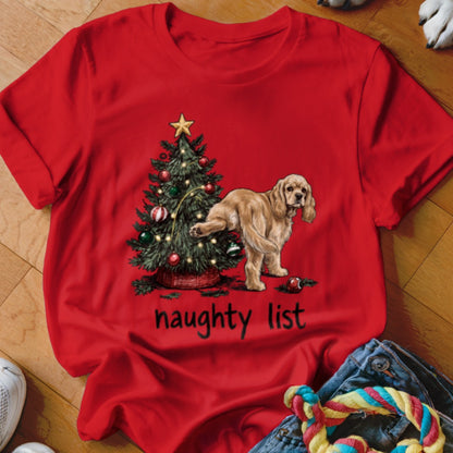 Red t-shirt with a Christmas tree and a dog, featuring text "naughty list".