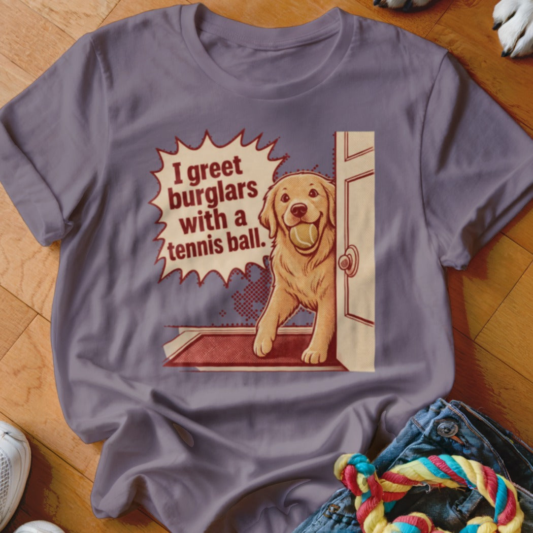 Golden retriever at door with tennis ball, text reads "I greet burglars with a tennis ball."