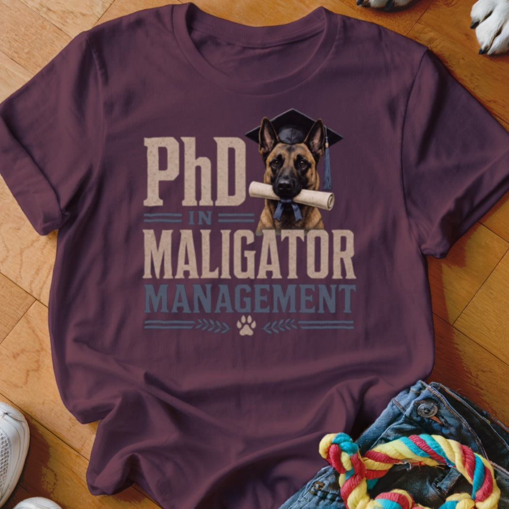 Maroon t-shirt with German Shepherd graphic and text "PhD in Maligator Management".