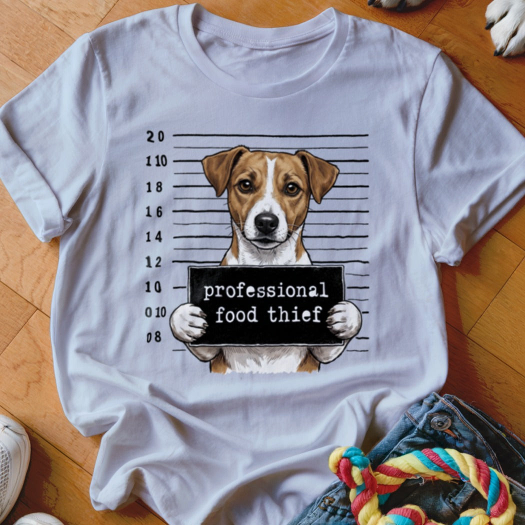 White t-shirt featuring a dog mugshot with "professional food thief" sign.