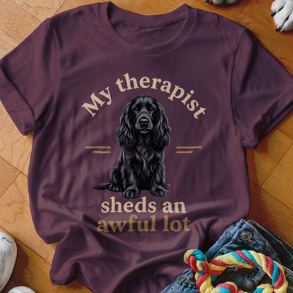 Maroon t-shirt with a black cocker spaniel and text "My therapist sheds an awful lot".