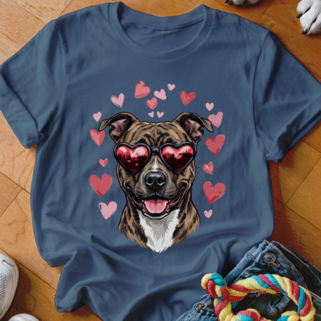 A blue crewneck t-shirt featuring a graphic of a brindle dog wearing heart-shaped sunglasses surrounded by pink hearts.