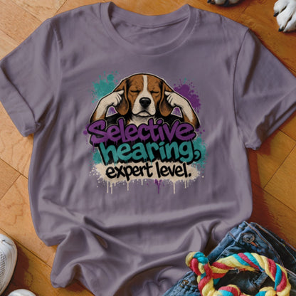 Beagle with paws over ears and text "Selective hearing expert level."