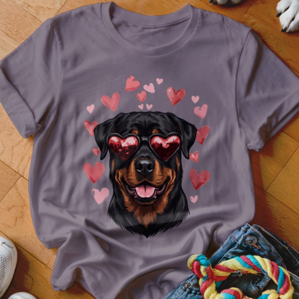 Gray t-shirt featuring a graphic of a Rottweiler wearing heart-shaped sunglasses surrounded by pink hearts.