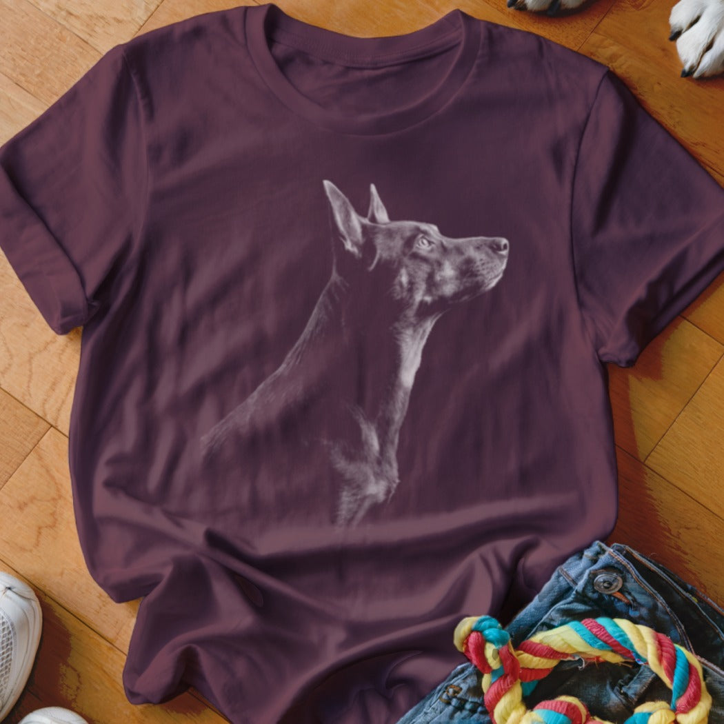 Burgundy t-shirt with white outline of a dog's head and neck, looking right.