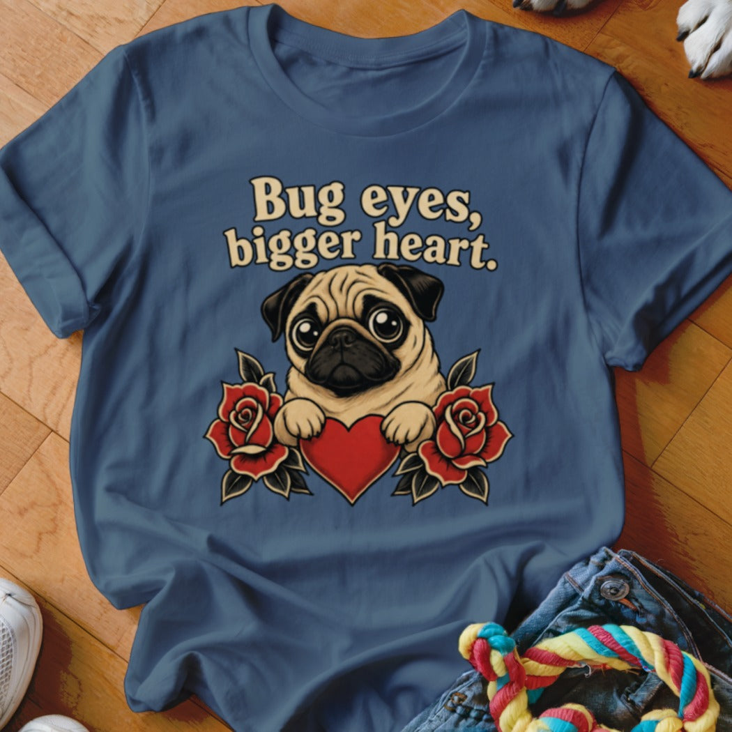 T-shirt with a pug holding a heart, surrounded by roses, text "Bug eyes, bigger heart."