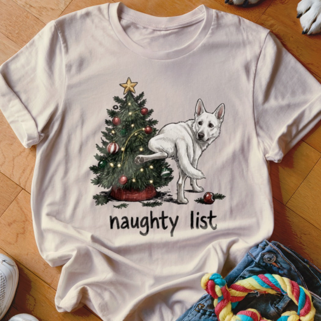 White German Shepherd near Christmas tree with text "naughty list".