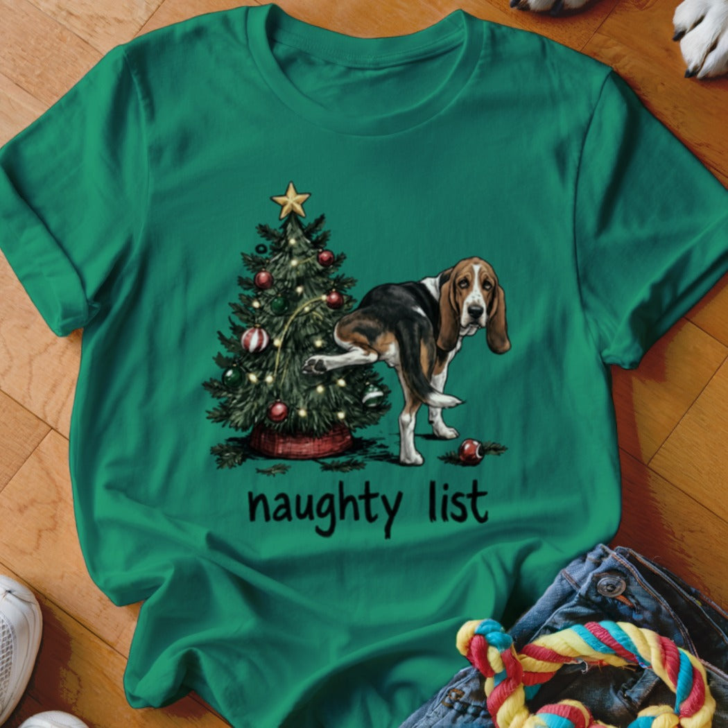 Green t-shirt with a Basset Hound and Christmas tree graphic that says "naughty list."