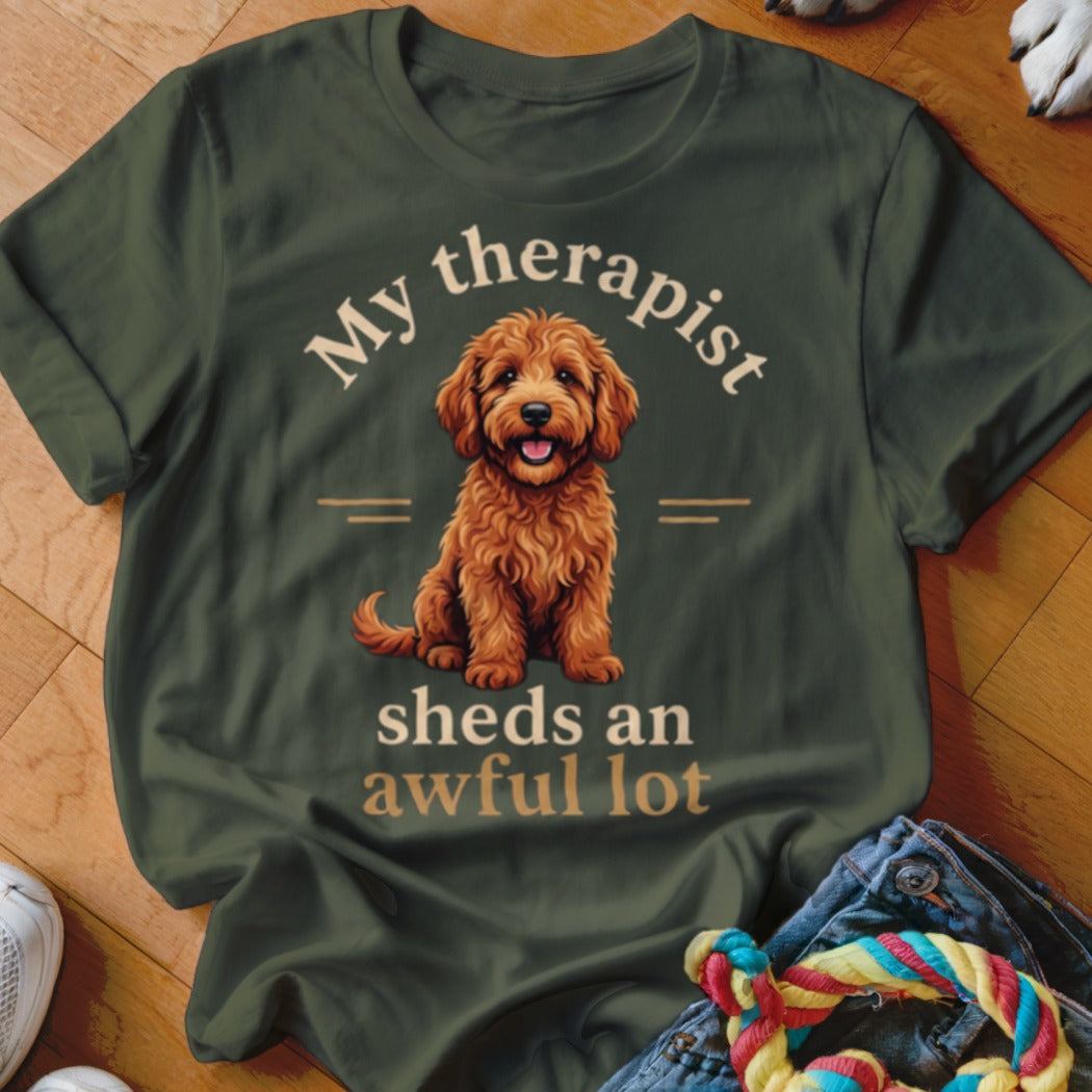 Green t-shirt with dog graphic and text "My therapist sheds an awful lot".