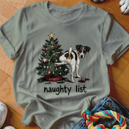 Dog lifting leg on Christmas tree with "naughty list" text below.