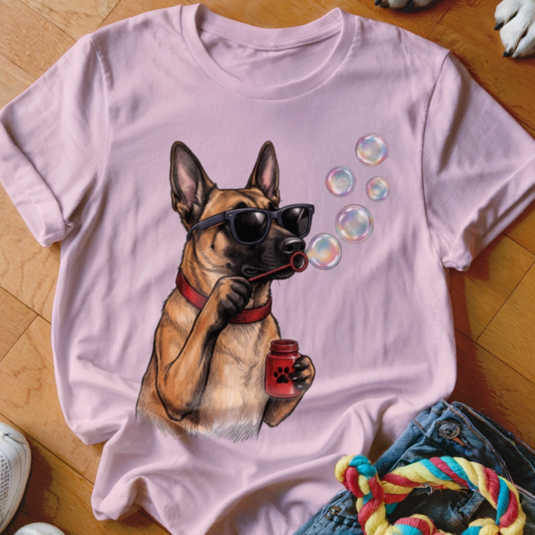 Light pink t-shirt featuring a graphic of a German Shepherd wearing sunglasses and blowing bubbles.