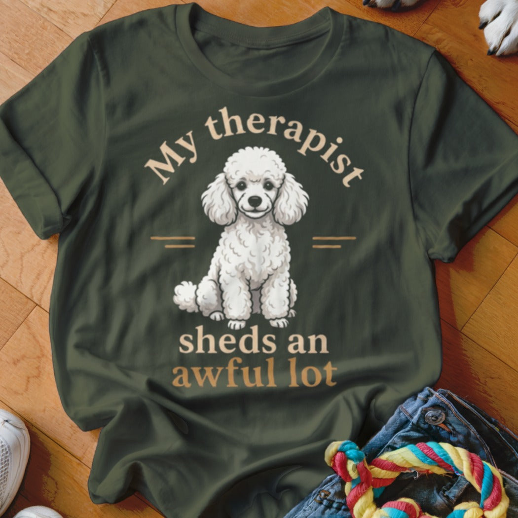 Green t-shirt with a white poodle graphic and text "My therapist sheds an awful lot".