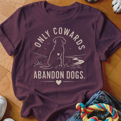Maroon t-shirt with white graphic of a dog sitting, "ONLY COWARDS ABANDON DOGS." text.