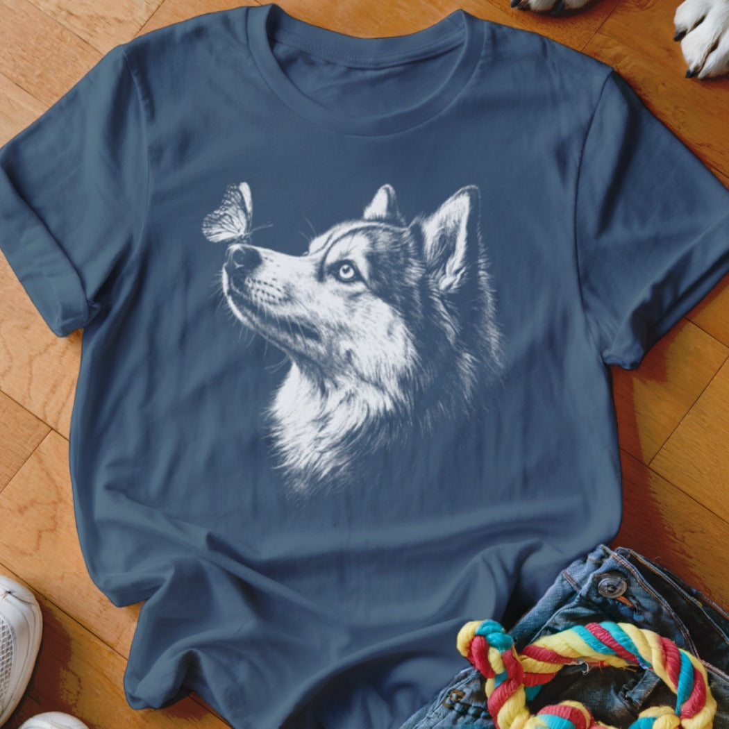 Dark blue crewneck t-shirt featuring a white sketch graphic of a husky dog looking at a butterfly.