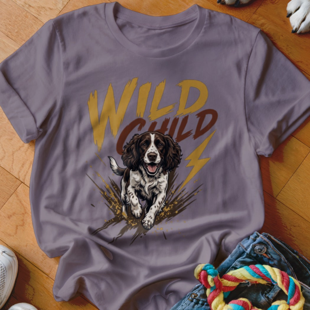 Purple crewneck t-shirt featuring a graphic of a brown and white dog and the text WILD CHILD.