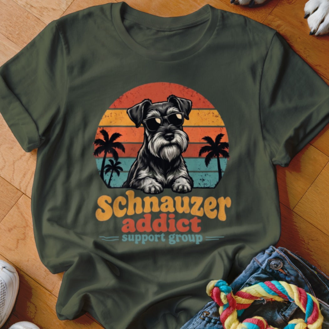 Dark green t-shirt featuring a retro graphic of a Schnauzer wearing sunglasses against a sunset.