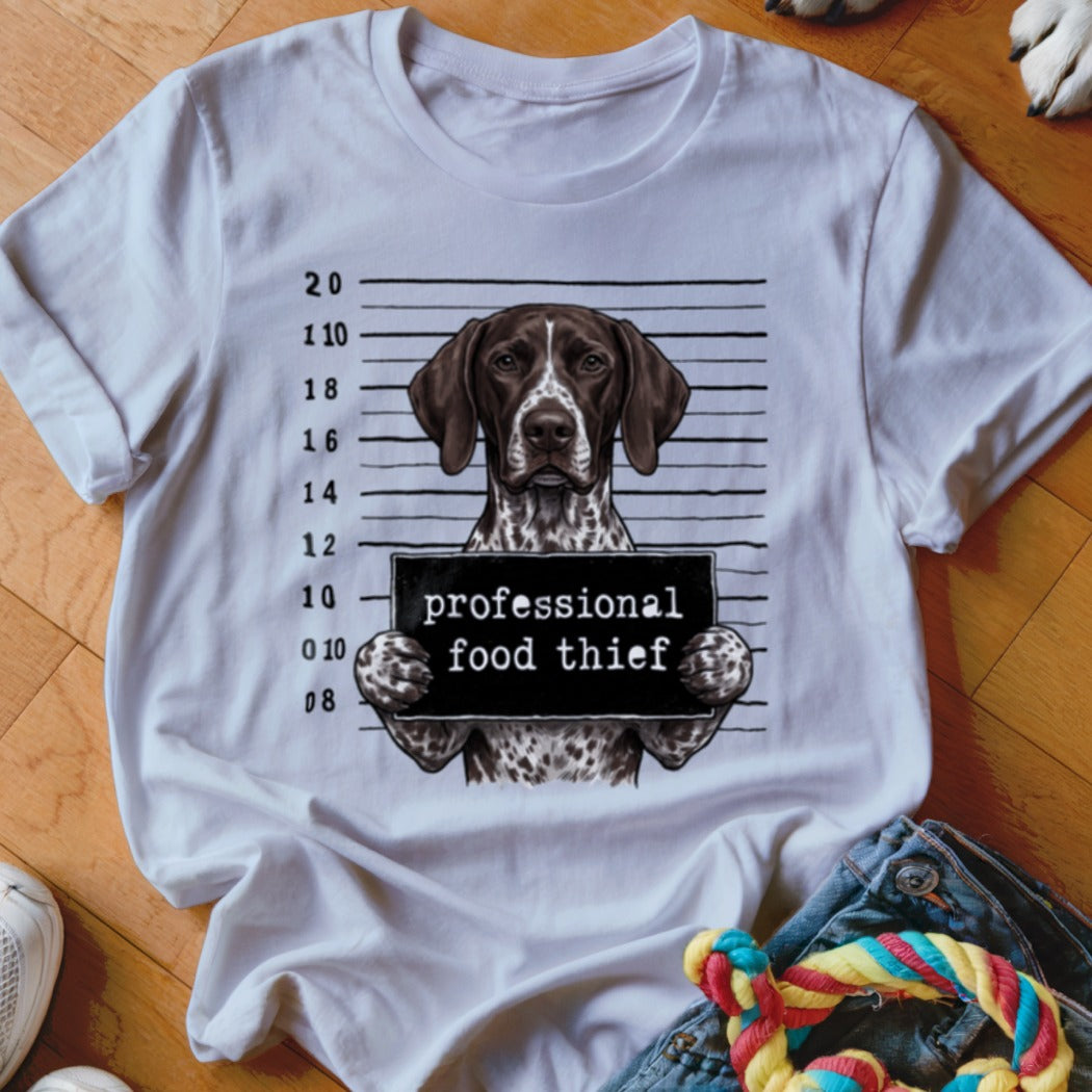 German Shorthaired Pointer in mugshot with "professional food thief" sign.