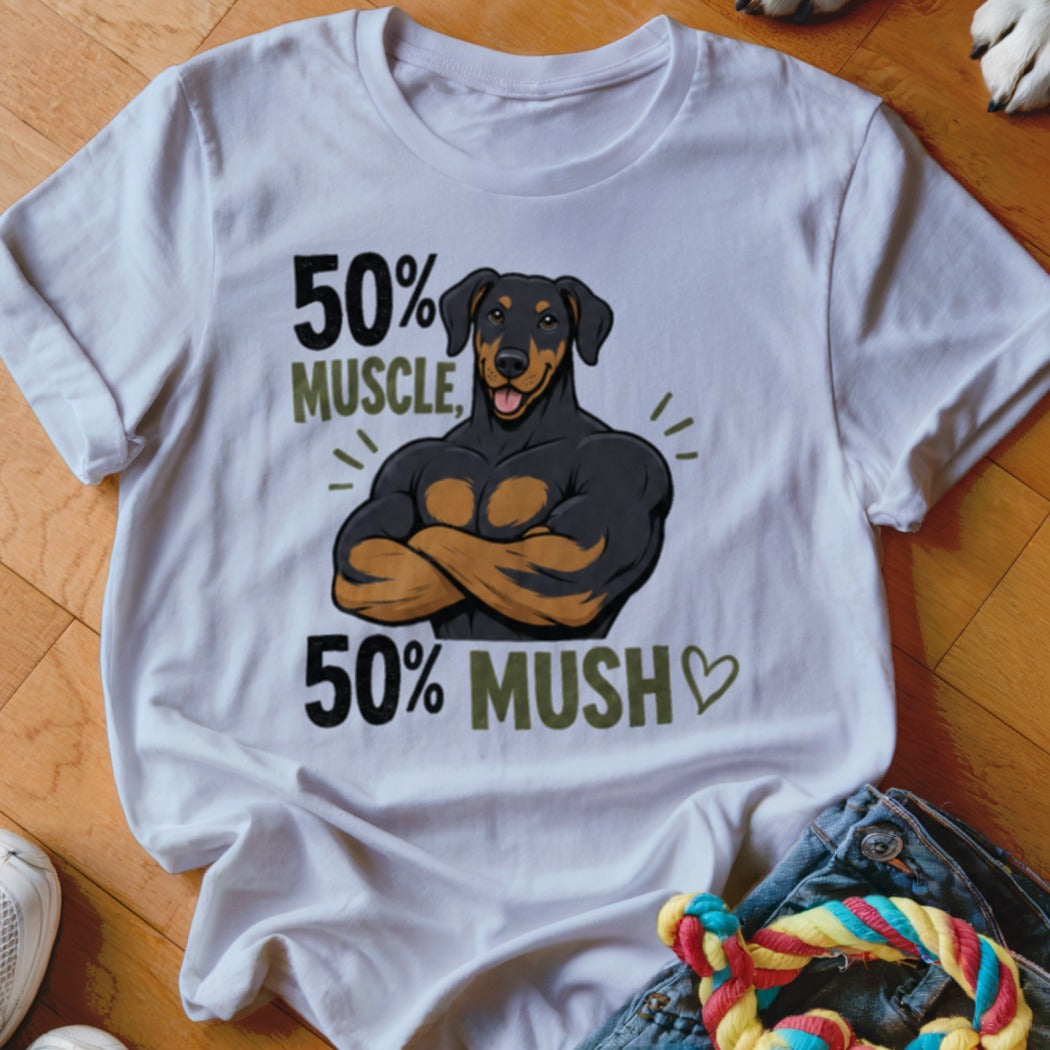 White t-shirt with illustration of muscular Doberman, "50% MUSCLE, 50% MUSH" text.