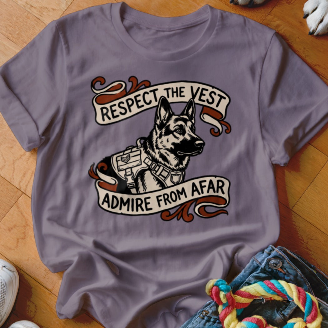 German Shepherd wearing a vest with text "Respect the Vest Admire From Afar".