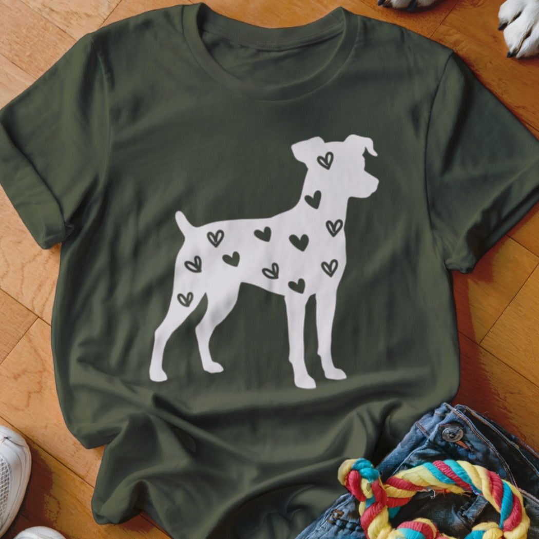White dog silhouette filled with black hearts on a dark green t-shirt.