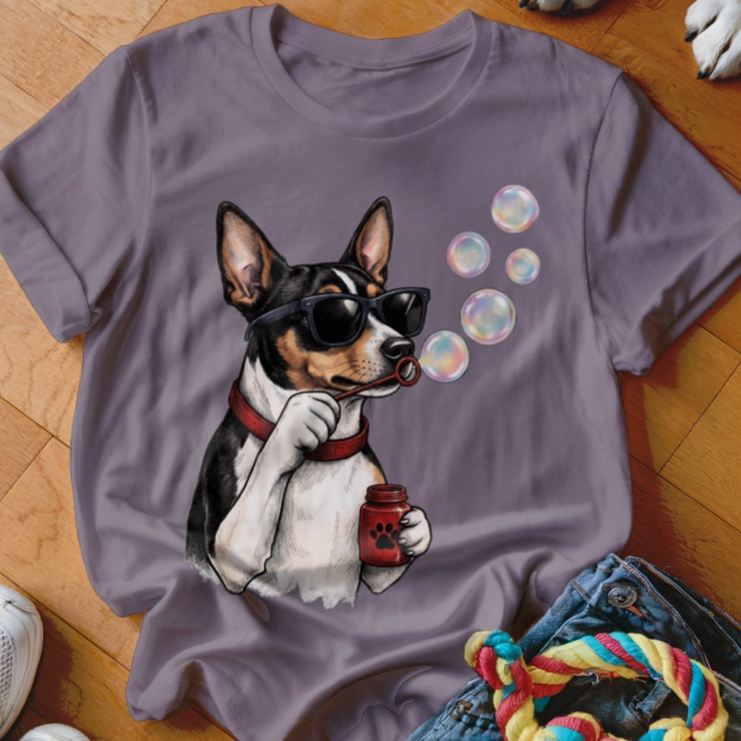 A grey short-sleeved t-shirt featuring an illustration of a black and white dog blowing bubbles.