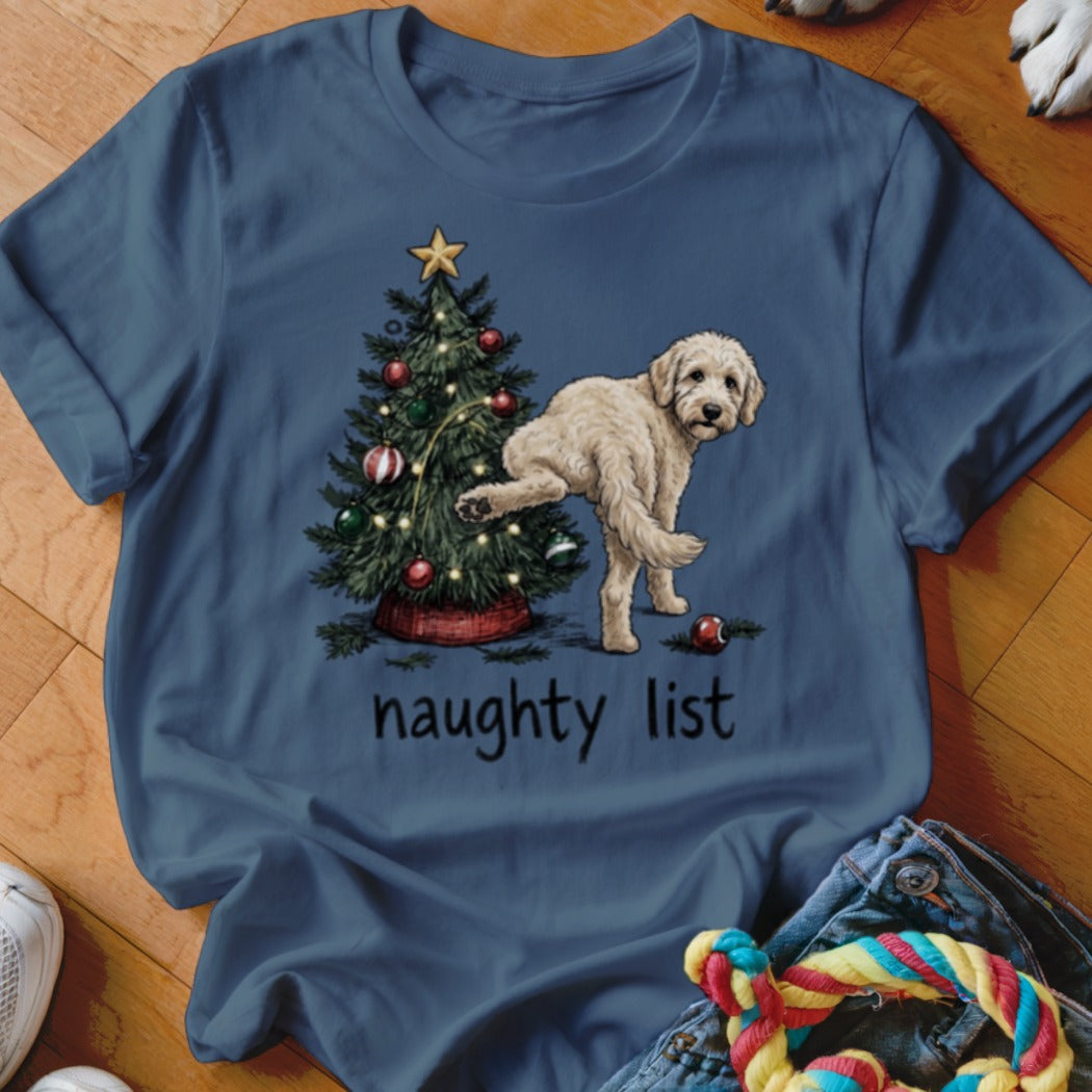 T-shirt with a doodle dog near a Christmas tree, text reads "naughty list".