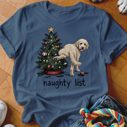T-shirt with a doodle dog near a Christmas tree, text reads "naughty list".