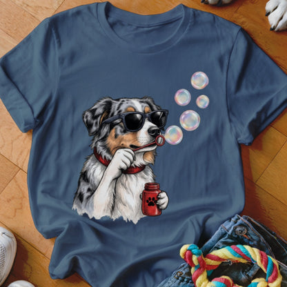 Blue crewneck t-shirt featuring a graphic of an Australian Shepherd wearing sunglasses and blowing bubbles.